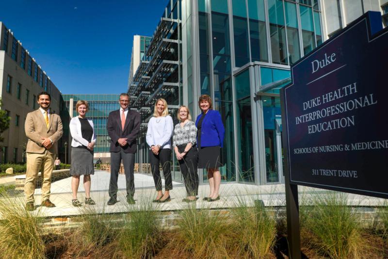 IPEC Leadership Team standing outside IPE building